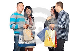 Two couples with shoppings bags