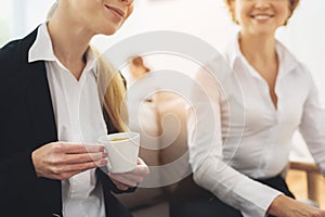 Two coworkers having coffee break