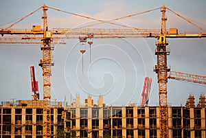 Two cranes on building building