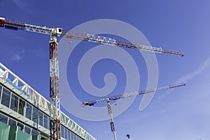 Two cranes in construction site