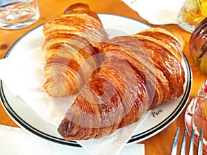 Two croissants seen from above in a cafe, Paris, France photo