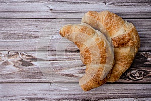 Two croissants on a table photo