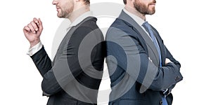 two cropped men in business suit stand back to back isolated on white, business support