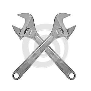 Two crossed adjustable spanner. Isolated