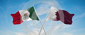 two crossed flags Qatar and mexico waving in wind at cloudy sky. Concept of relationship, dialog, travelling between two countries