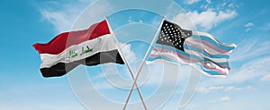 two crossed flags TransAmerica and Iraq waving in wind at cloudy sky. Concept of relationship, dialog, travelling between two