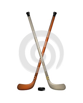 Two crossed ice hockey sticks and puck