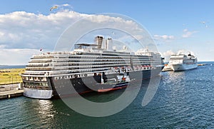 Two cruise ships are moored at the Ocean Quay Cruise Terminal in Copenhagen, Denmark