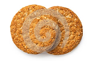 Two crunchy oat and wholemeal biscuits isolated on white. Top view