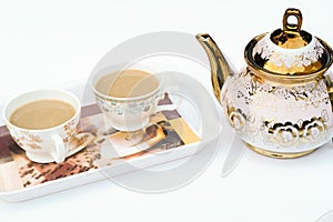 Two cup of coffee on a tray with white background