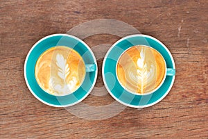 Two cup of hot coffee with latte art. Favorite caffeine beverage. Refreshment drink in morning