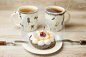 Two Cup of tea and cake on the table