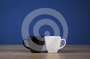 Two cups black and white