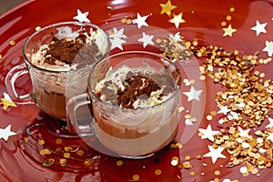 two cups of cappuccino placed in a red tray