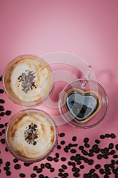 Two cups of coffee. Postcard for women's day on March 8. Trendy pink background. March 8 and the concept of Women's Day