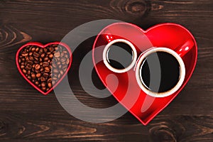 Two cups of coffee in the red heart