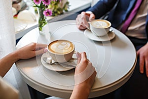 Two cups of coffee on a table in a cafe