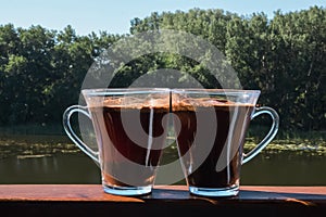 Two cups of coffee on the terrace in the open air. Morning coffee for two on a private terrace at home