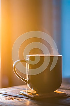 Two cups with coffee on the wooden table