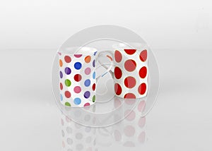 two cups with dots texture isolated on white