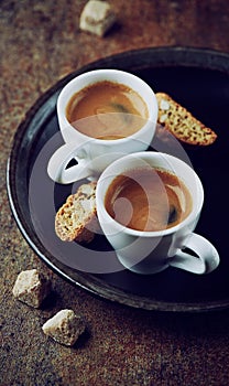 Two cups of espresso with cantuccini