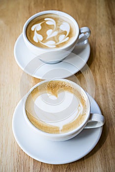 Two cups of hot cappuccino coffees photo
