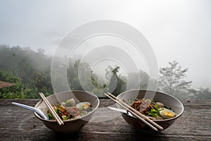 Two cups noodles with beautiful fog photo