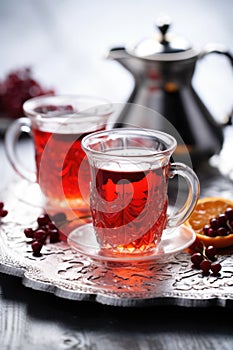 Two cups of tea on a silver tray. Red turkish tea