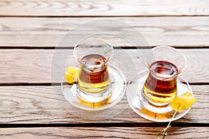 Two cups of traditional Turkish tea on a table in a street cafe in Istanbul, Turkey.