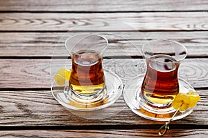 Two cups of traditional Turkish tea on a table in a street cafe in Istanbul, Turkey.