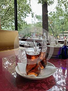 Two cups of Turkish tea in a summer city cafe