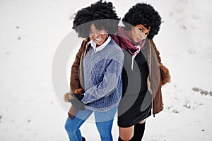 Two curly hair african american woman