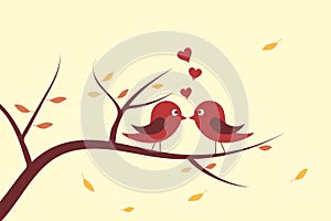 Cute bird in love on autumn day kissing on branches with dry and fallen leaves