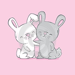 Two cute bunnies, one white and one grey, hugging