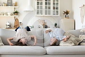 Two cute energetic sibling kids having fun at home