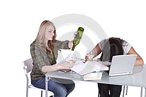 Two cute girls studying at thier desks