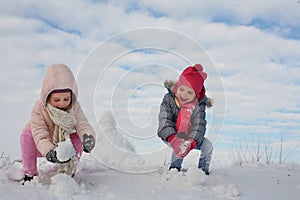 Two cute grill in the snow.