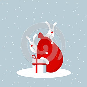 Two cute happy smiling white bunnies or hares peeking out from behind Santa claus red bag with christmas gifts. Editable