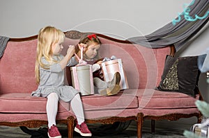 Two cute little girls in a festive New Year`s atmosphere