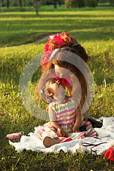 Two cute little girls having fun at summer day