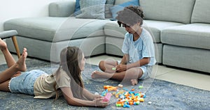 Two cute sibling brother and sister kids playing learning game