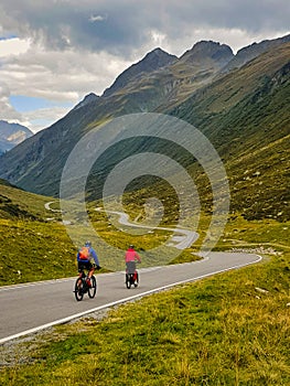 Two cyclists descent from the Silvretta-pass.