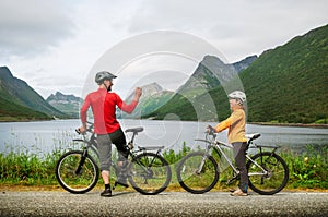 Two cyclists relax biking