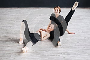 Two dancers friends practice in dance studio