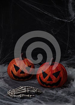 Two dark pumpkin halloween in black background