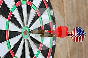 Two Dart arrow hit on dartboard in the center Differential accuracy concept