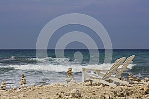 Two deck chair front at the ocean