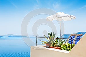 Two deck chairs and beach umbrella