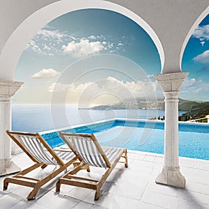 Two deck chairs on terrace with pool with stunning sea view. Traditional mediterranean white architecture with arch. Summer