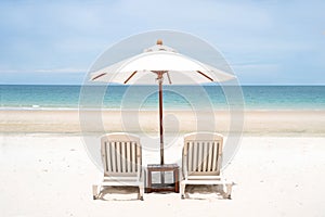 Two deckchairs on a beautiful beach . Thailand